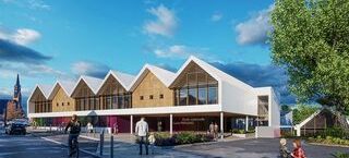 Projection 3D du projet de construction de l'école Louis Pergaud à Guipavas : un bâtiment avec façade en bois clair et revêtement blanc avec de grands vitrages.