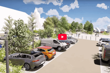 image miniature d'une video portant sur la requalification des espacesn au centre-ville de Guipavas. Il s'agit d'une maquette. On y voit un parking arboré avec plusieurs véhicules en stationnement. Le ciel est bleu. On devine en arrière-plan des bâtiments blancs.